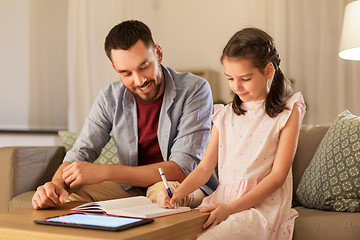 Image showing father and daughter doing homework together