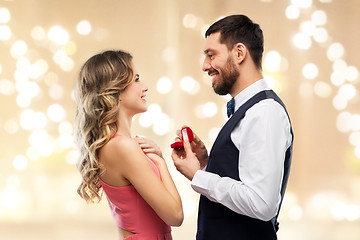 Image showing man giving woman engagement ring on valentines day