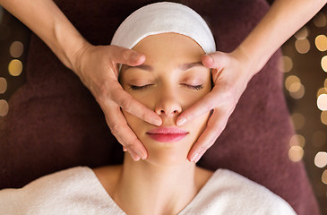 Image showing woman having face and head massage at spa