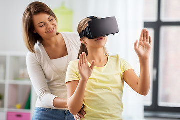 Image showing mother and daughter in vr glasses playing at home