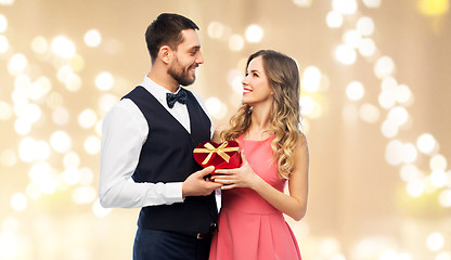 Image showing happy couple with gift on valentines day