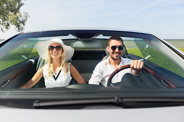 Image showing happy man and woman driving in cabriolet car