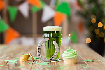 Image showing glass of beer, cupcake, horseshoe and gold coins