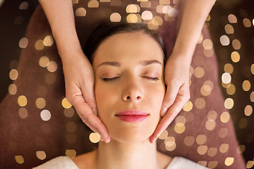 Image showing woman having face and head massage at spa