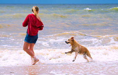 Image showing A girl with a dog 