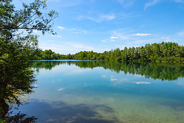 Image showing Forest lake in German national park with clear blue sky reflecti
