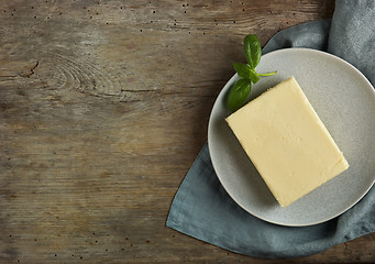 Image showing butter on old wooden table