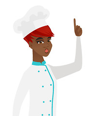 Image showing African chef with open mouth pointing finger up.