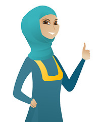 Image showing Young muslim business woman giving thumb up.
