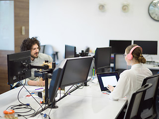 Image showing businesswoman using a laptop in startup office