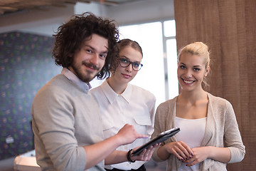 Image showing Business People Working With Tablet in startup office