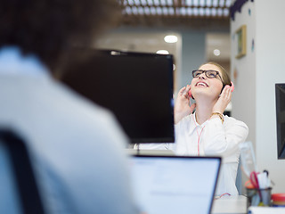 Image showing businesswoman using a laptop in startup office