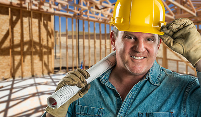 Image showing Smiling Contractor in Hard Hat Holding Floor Plans At Constructi