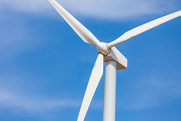 Image showing Single Wind Turbine Over Dramatic Blue Sky