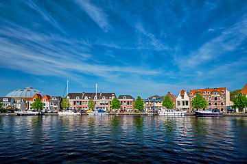 Image showing Boats and houses on Spaarne river. Haarlem, Netherlands