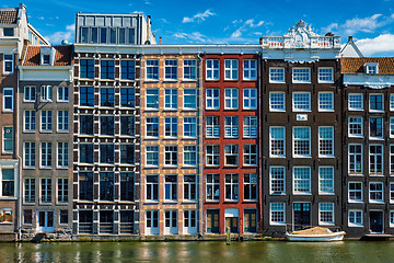 Image showing  houses and boat on Amsterdam canal  Damrak with reflection. Ams