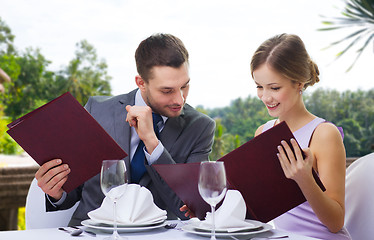 Image showing couple with menus at restaurant