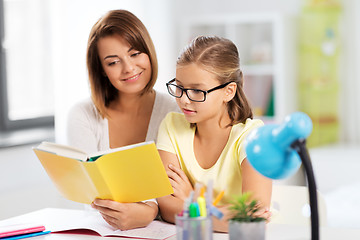 Image showing mother and daughter doing homework together