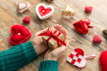 Image showing close up of hands holding christmas gift