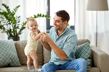 Image showing father with little baby daughter at home