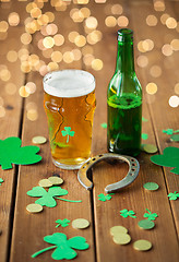 Image showing glass of beer, bottle, horseshoe and gold coins