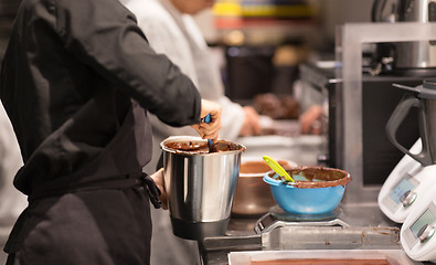 Image showing chef making chocolate at confectionery shop