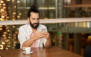 Image showing man with coffee and smartphone at restaurant