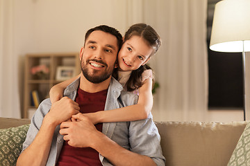 Image showing happy father and little daughter hugging at home