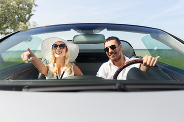 Image showing happy man and woman driving in cabriolet car