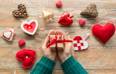 Image showing hands holding christmas or valentines day gift