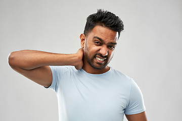 Image showing unhealthy indian man suffering from neck pain