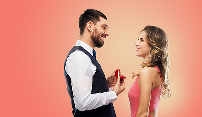 Image showing man giving woman engagement ring on valentines day