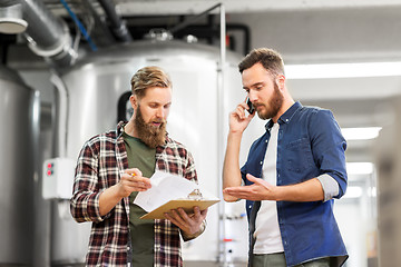 Image showing men working at craft brewery or beer plant