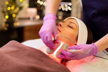 Image showing young woman having face microdermabrasion at spa