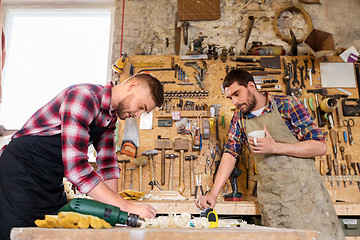 Image showing carpenters working and drinking coffee at workshop