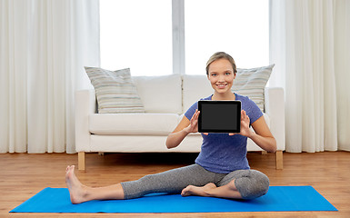 Image showing woman with tablet computer doing yoga at home