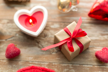 Image showing christmas gift, heart shaped decorations, candle