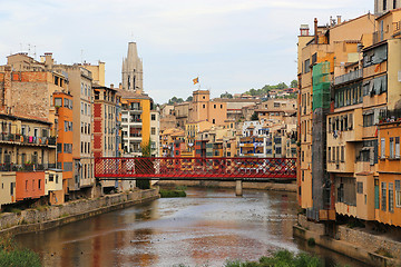 Image showing Colorful houses and Eiffel bridge on river Onyar in Girona