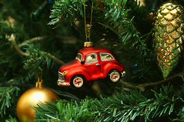 Image showing Red car toy, cone and ball on Christmas tree