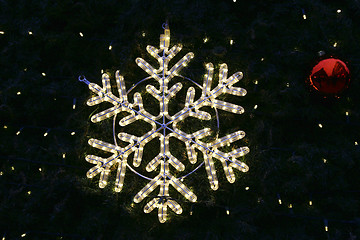 Image showing Beautiful christmas decoration, bright glowing snowflake