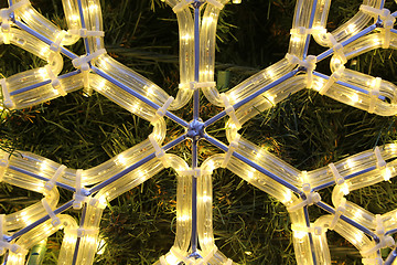 Image showing Close-up of bright glowing led christmas snowflake