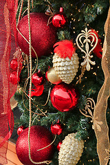 Image showing Beautiful Christmas decoration with balls, cones and ribbons