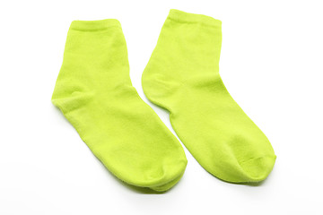 Image showing Pair of lime color socks isolated on white