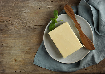 Image showing butter on old wooden table