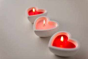 Image showing heart shaped candles burning on valentines day