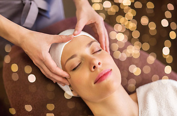 Image showing woman having face and head massage at spa