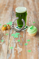 Image showing glass of beer, cupcake, horseshoe and gold coins