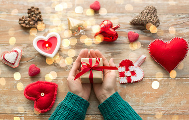 Image showing hands holding christmas or valentines day gift