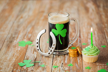 Image showing glass of beer, horseshoe, green cupcake and coins