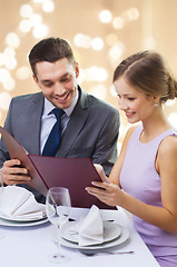 Image showing couple with menu at restaurant